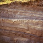 Pit showing interstratified dense andesite surge and phreatomagmatic layers, central St. Eustatius .