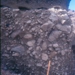 Reverse-graded semi-vesicular andesite block and ash flow deposit in Compagnie Baai.