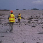 Dr Keith Rowley and personnel of Seismic research Unit studying deposits from June 25, 1997 eruption , location on outskirts of Bramble airport on east coast.