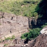 Section through deposits from South Soufriere hills in O'Garra's quarry; well bedded sequence of scoriaceous fall deposits overlain by a sequence of pyroclastic flows.